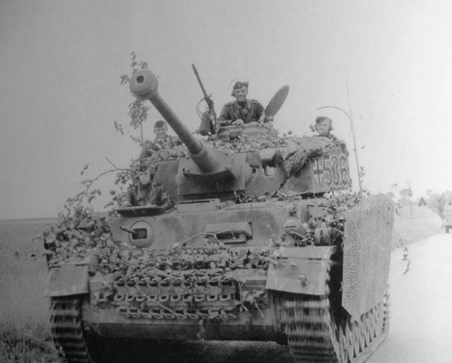 An unusual Panzer IV with Zimmerit covering its Schurzen side plates