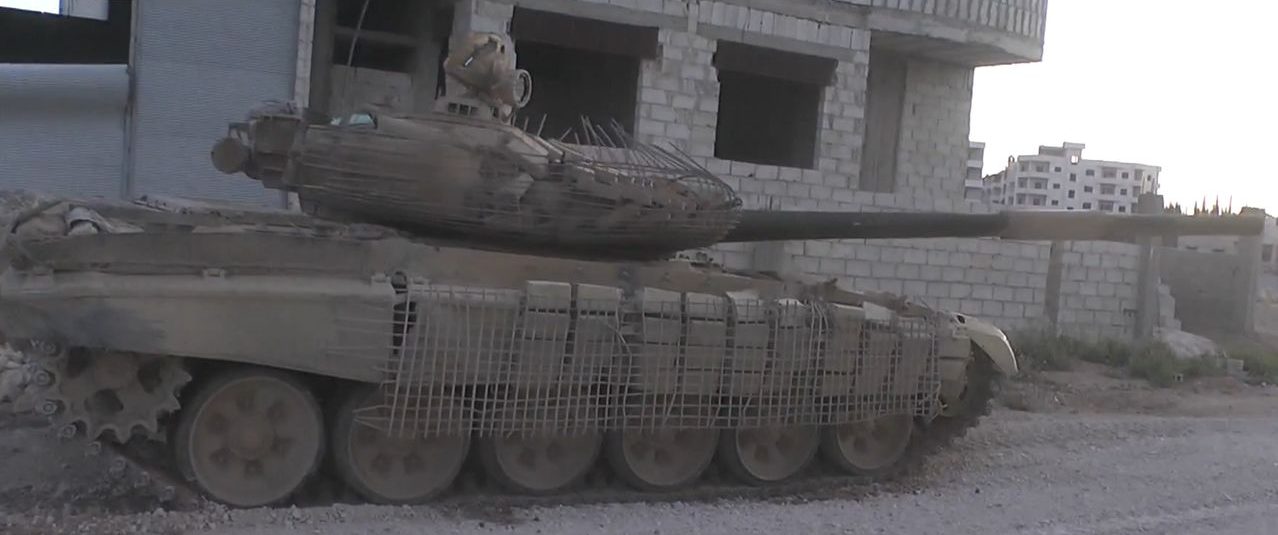 T-72AV with crude cage armor. This was a precursor to the T-72 Mahmia, and often was used to replace lost ERA bricks with construction bricks