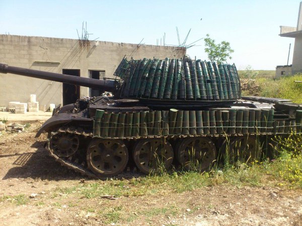 A T-55 fitted with spent shell cases as spaced armor. The effectiveness and reliability of this upgrade is very questionable, but was a precursor to the T-72 Mahmia.