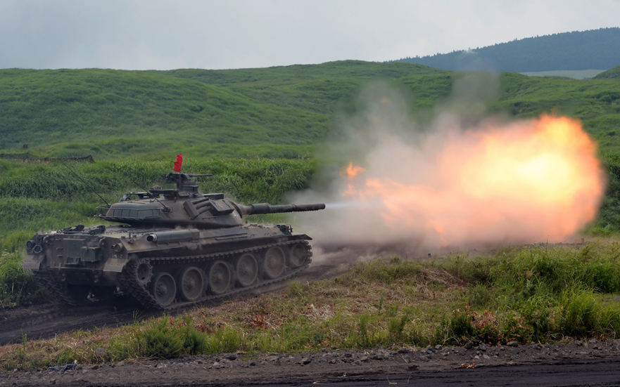 The Type 74 fires its Royal Ordnance L7 105mm main armament
