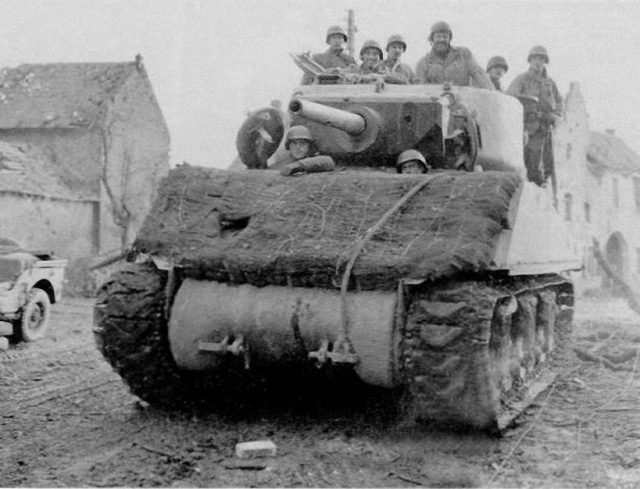 M4A3E2 of 743rd Tank Btn, Altdorf, 27th November 1944. Sandbags covered with hessian and possible turf on the glacis.